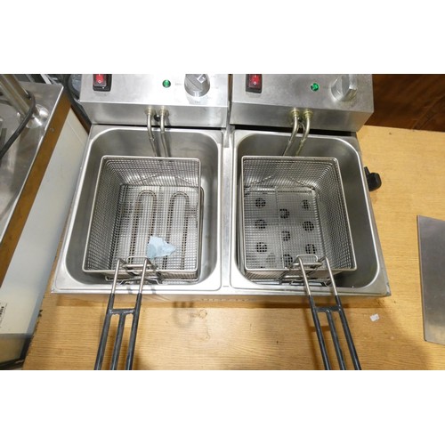 1101 - A commercial stainless steel twin basket deep fryer by Buffalo, 240v - trade