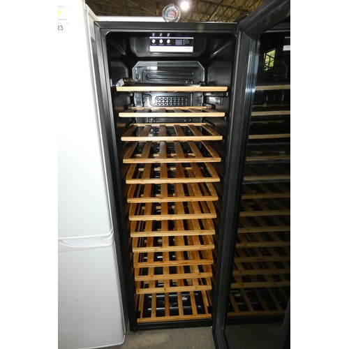 1144 - A black upright wine fridge by Hoover approx 145x59, door handle inside - trade. Tested Working.