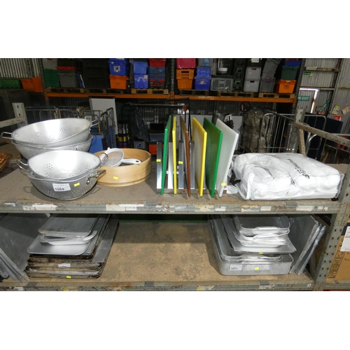 1069 - A quantity of various catering related items including colanders, spill kit, chopping boards etc. Co... 