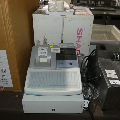 1102 - A cash register by Sharp Type XE-A213 with manual and till rolls, keys in auction office - trade Tes... 