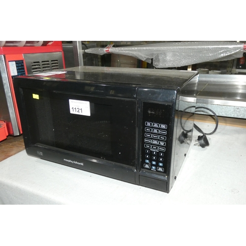 1121 - A black microwave oven by Morphy Richards - trade Tested Working