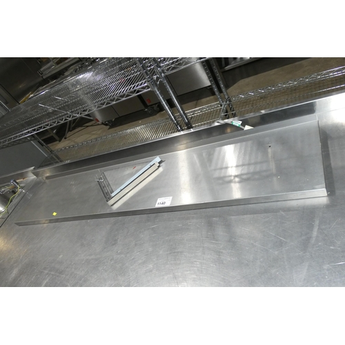 1140 - A commercial stainless steel catering type shelf with brackets approx 150x30cm