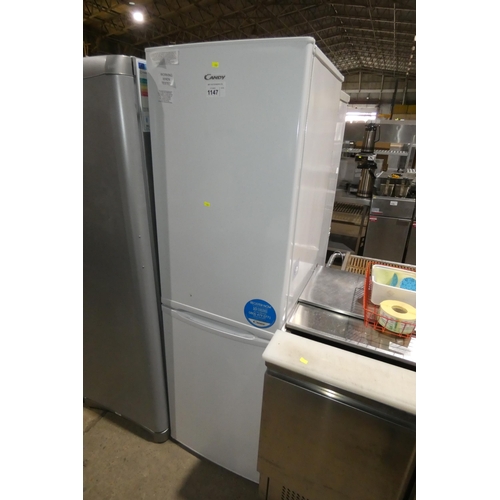 1147 - A tall white fridge freezer by Candy type FD2-33-1 - trade Tested Working