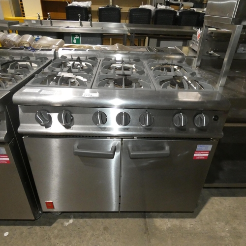 1175 - A gas fired commercial stainless steel 6 burner range with 2 door oven beneath by Falcon - trade