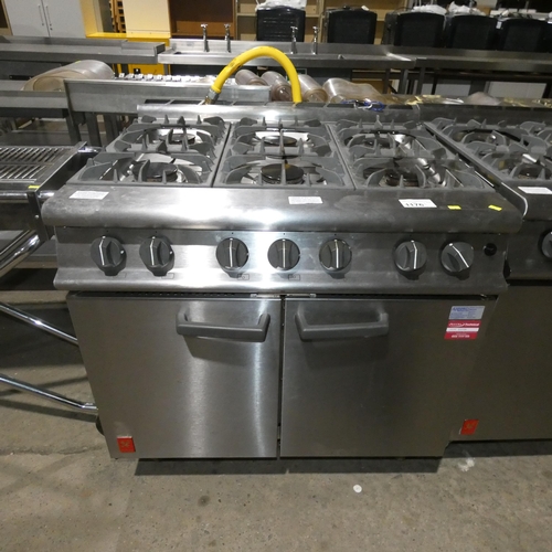 1176 - A gas fired commercial stainless steel 6 burner range with 2 door oven beneath by Falcon - trade