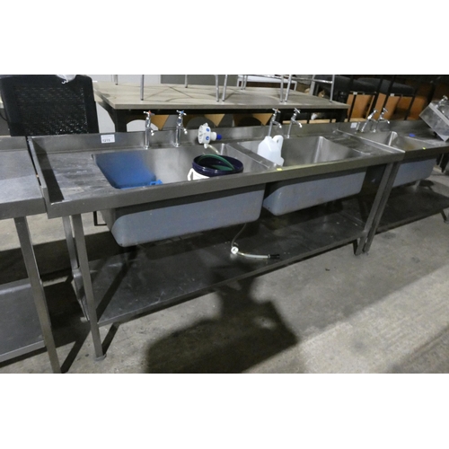 1215 - A commercial stainless steel twin deep sink unit with shelf beneath approx 210x60cm