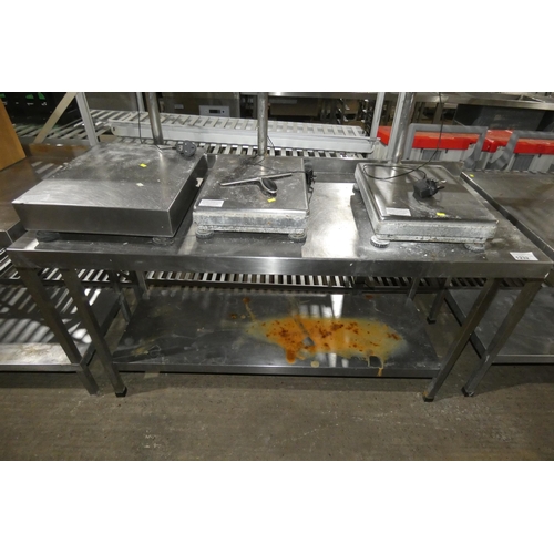 1232 - A commercial stainless steel catering type table with shelf beneath approx 150x65cm