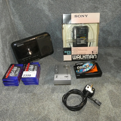 2358 - A vintage boxed Sony Walkman with original earbud headphones type WM-B39, a cap10 vintage portable r... 