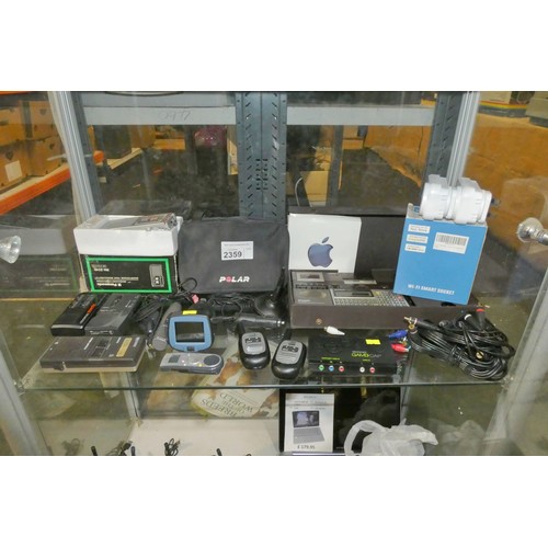 2359 - A quantity of various electronic related items including Dictaphones, small satnav, Motorola T4512 2... 