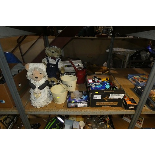 2164 - A quantity of various household and other items including soft toys, toys, light bulbs, wine racks, ... 