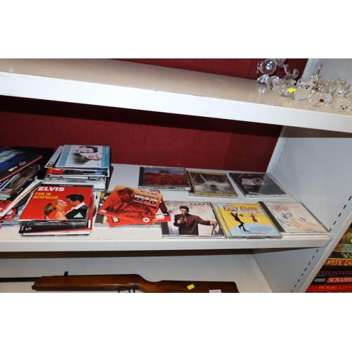 3006 - A quantity of miscellaneous DVDs & CDs (one shelf)