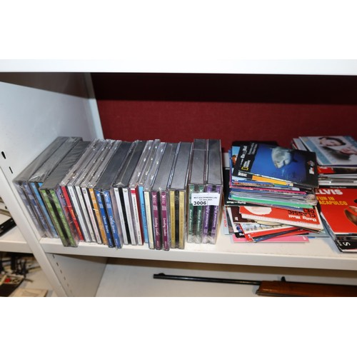 3006 - A quantity of miscellaneous DVDs & CDs (one shelf)
