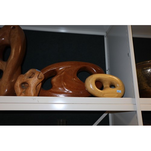 3037 - A collection of five large carved wooden ornaments (one shelf)