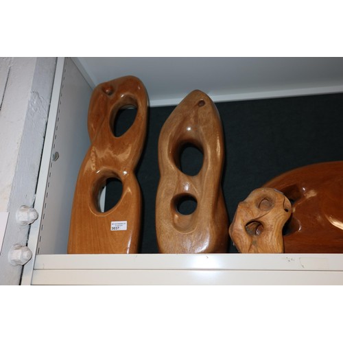 3037 - A collection of five large carved wooden ornaments (one shelf)