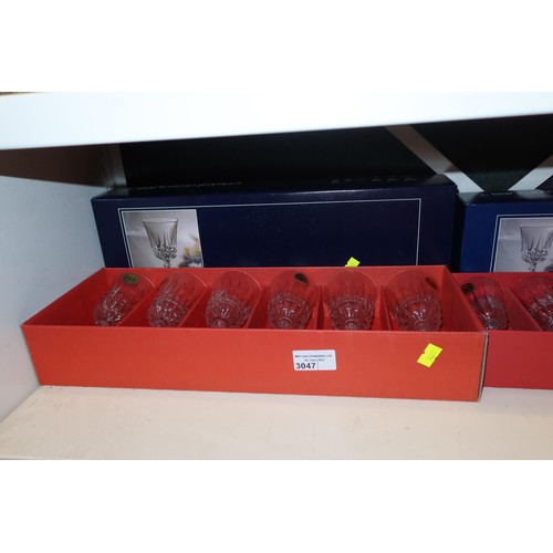 3047 - A quantity of miscellaneous decorative drinking glasses and boxed sets of glasses (three shelves)