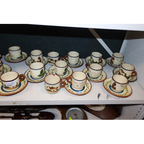 3051 - A quantity of Torquay ware slogan decorated coffee cups and saucers and other similar pottery (one s... 