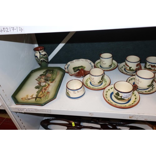 3051 - A quantity of Torquay ware slogan decorated coffee cups and saucers and other similar pottery (one s... 