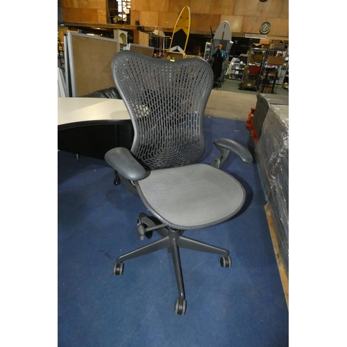 1379 - A grey office swivel chair by Herman Miller type Mirra 1, slight nick in the seat