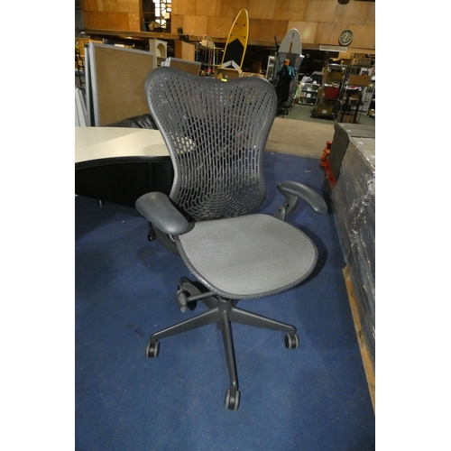 1380 - A grey office swivel chair by Herman Miller type Mirra 1, slight nick in the seat