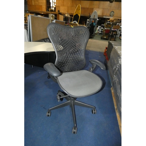 1382 - A grey office swivel chair by Herman Miller type Mirra 1, slight nick in the seat