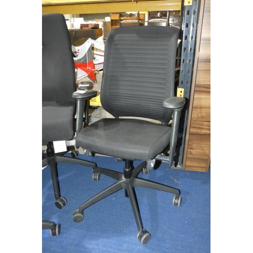 1395 - A black upholstered office swivel chair with lumbar support