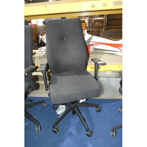 1396 - A black upholstered office swivel chair with lumbar support and high back