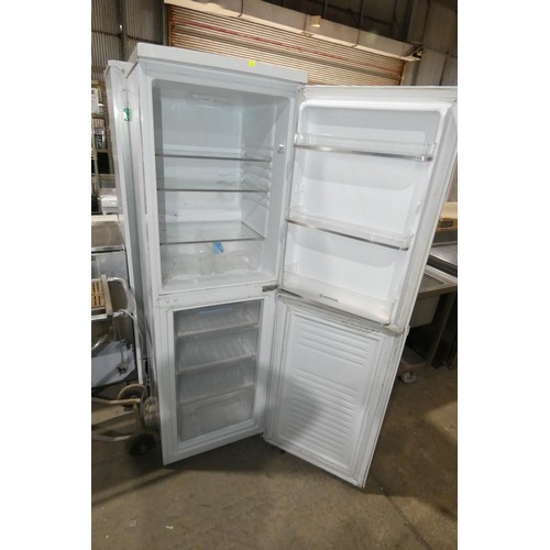 1161 - A tall white fridge freezer by Hoover, requires attention as freezer works but fridge fails to reach... 