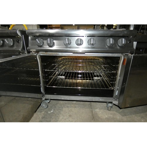 1175 - A gas fired commercial stainless steel 6 burner range with 2 door oven beneath by Falcon - trade