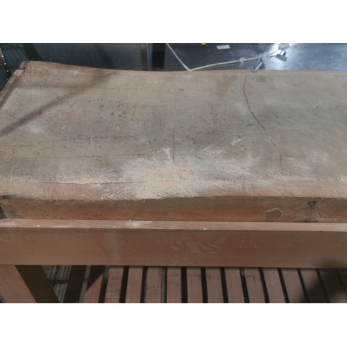 1151 - A large commercial wooden chopping board on a wooden stand approx 156x65x106. Please note this will ... 