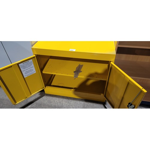 1260 - A metal yellow COSHH cabinet with lock and keys