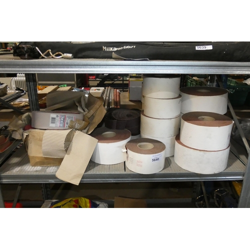 5640 - A quantity of various rolls of abrasives and sanding belts. Contents of 1 shelf