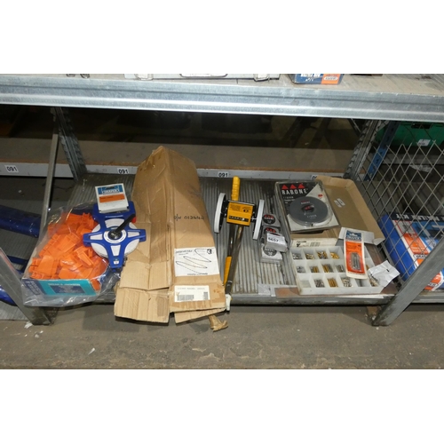 5657 - A quantity of various items including tape measures, a measuring wheel, screwdriver bits etc. Conten... 