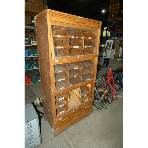 5866 - A vintage wooden shop cabinet by Dudley approx 100 x 48 x 198cm high. Please note the cabinet has th... 