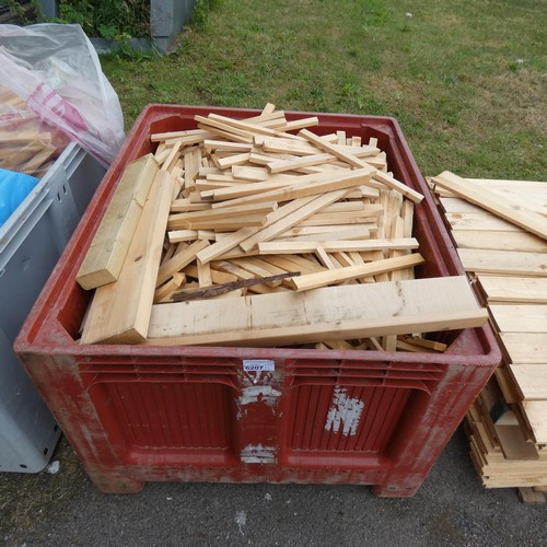 6207 - A qty of wood offcuts. Please note container is not included.