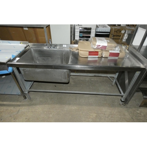 1132 - A commercial stainless steel large deep single sink unit with draining board to the right approx 184... 