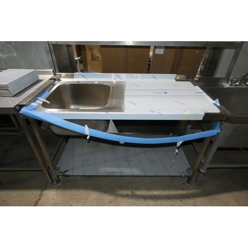 1133 - A commercial stainless steel single sink unit with draining board to the right and shelf beneath app... 