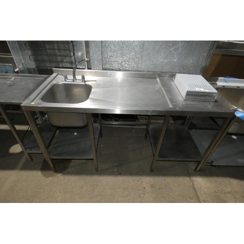 1135 - A commercial stainless steel single sink unit with 2 shelves and utility space beneath