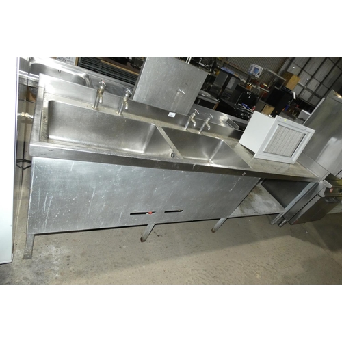 1150 - A commercial stainless steel double sink unit with shelf and draining board approx 290x69cm