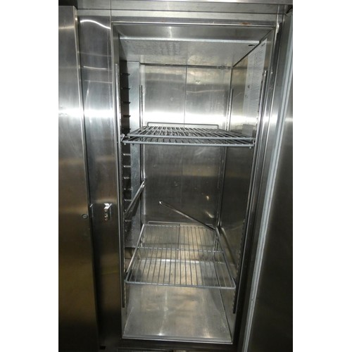 1152 - A large commercial stainless steel double door freezer by Foster no model visible missing bottom gri... 