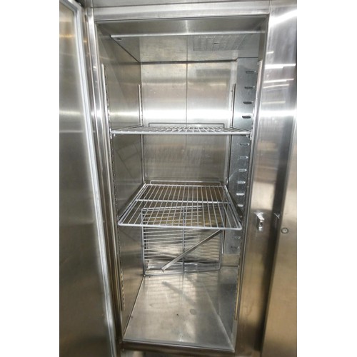 1152 - A large commercial stainless steel double door freezer by Foster no model visible missing bottom gri... 