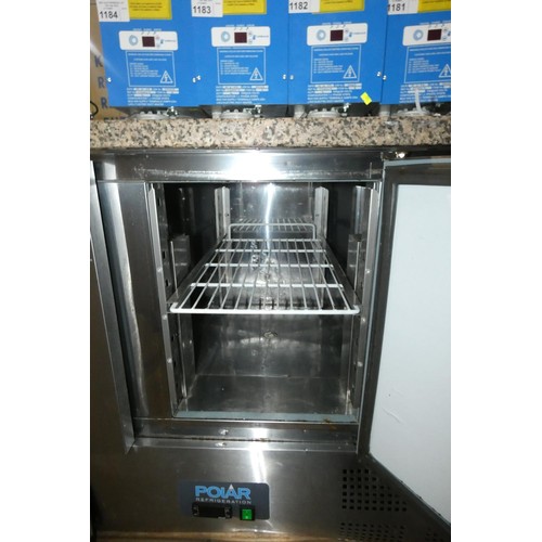 1179 - A commercial stainless steel 3 door bench fridge by Polar, unit has some damage to front grill - tra... 