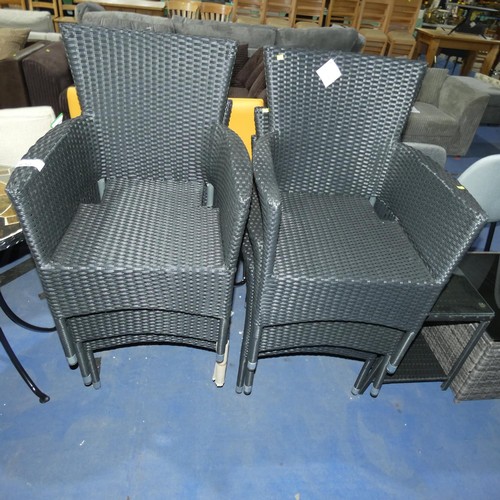 632 - 6 x Outfit black synthetic rattan stacking garden chairs (no cushions) and 1 x small matching glass ... 