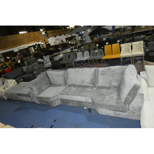 657 - A large grey upholstered five section U shaped sofa - Please note that this sofa has torn fabric on ... 