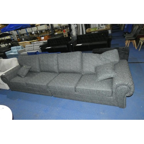 660 - A dark grey upholstered two part four person sofa, overall approx 320cm wide