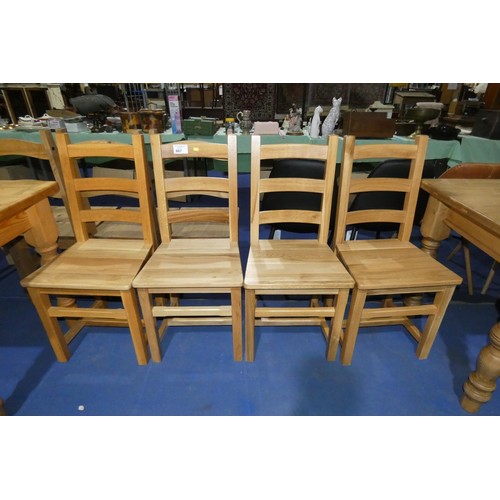 667 - A set of 4 wooden ladder back dining chairs