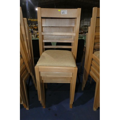 672 - A set of 4 wooden dining chairs with light coloured upholstered seat pads