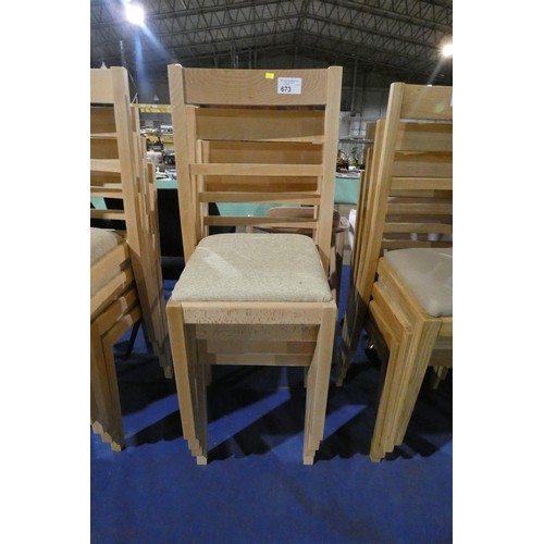 673 - A set of 4 wooden dining chairs with light coloured upholstered seat pads