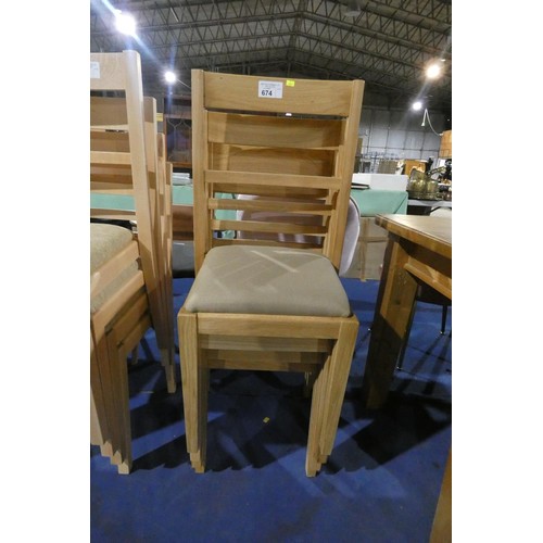 674 - A set of 4 wooden dining chairs with darker coloured upholstered seat pads