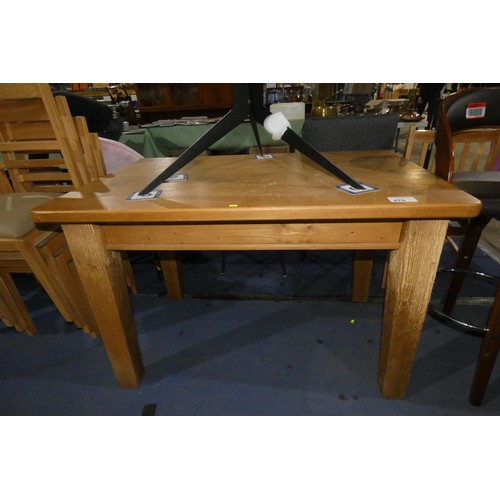 676 - 1 x Pine dining table approx 120 x 76cm - Please note that the legs of this table have very noticeab... 