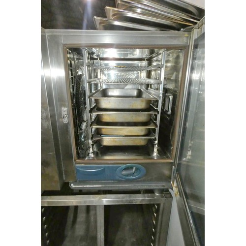 1221 - A commercial stainless steel 6 grid combi oven by Rational type 5-senses, comes with trays & tray ra... 